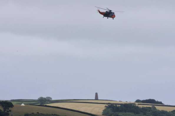 23 July 2020 - 15-02-18
Dara the Sea King heads off back to Portland over the Daymark. And there's that tent again.
------------------
HeliOperations Sea King XV166